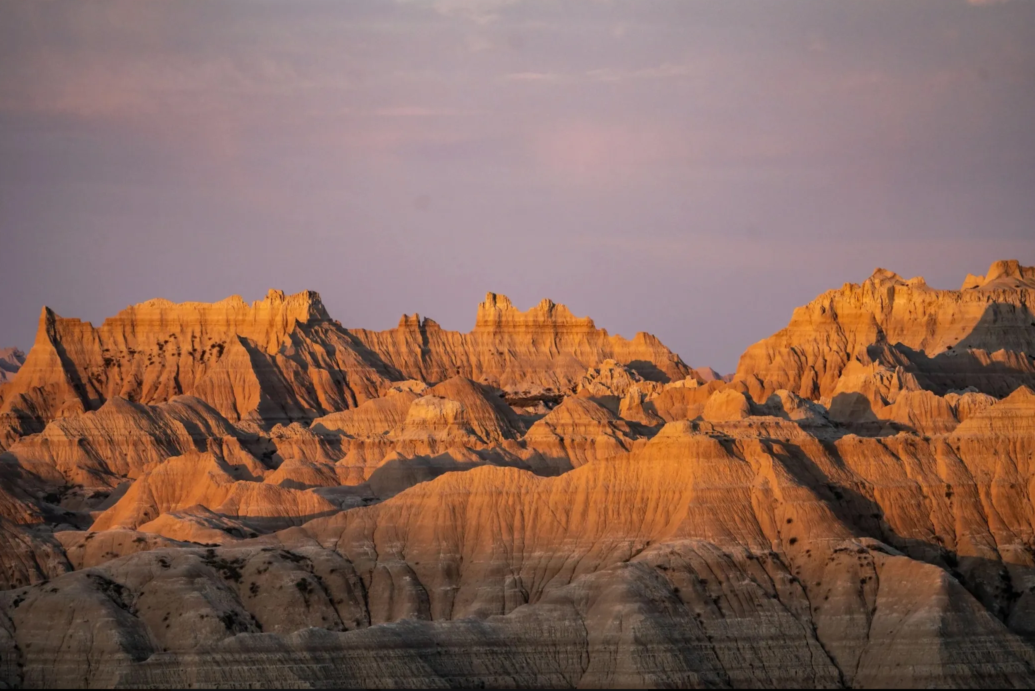 Rugged sandstone terrain at sunset.