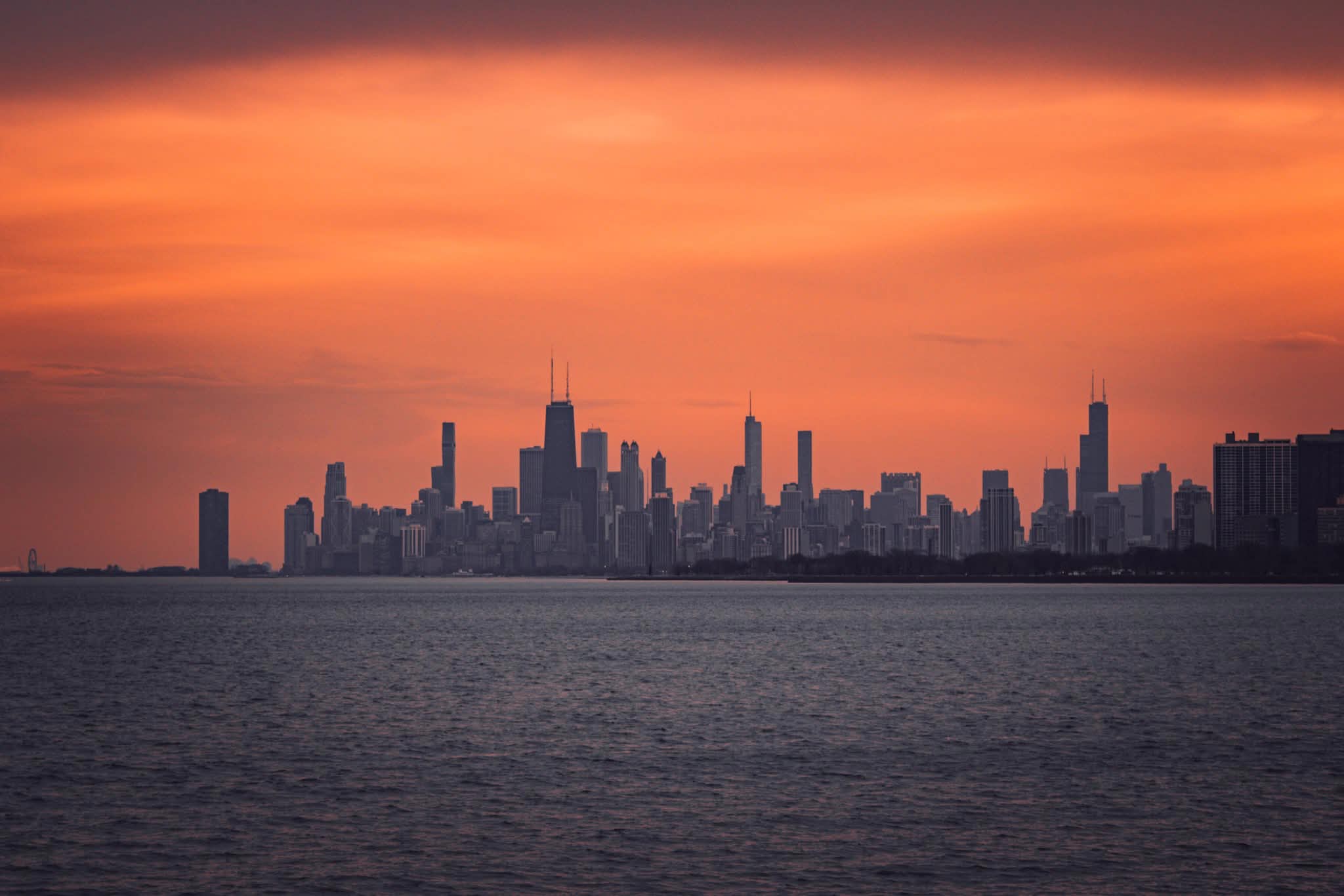The Chicago skyline from Montrose beach at sunset.