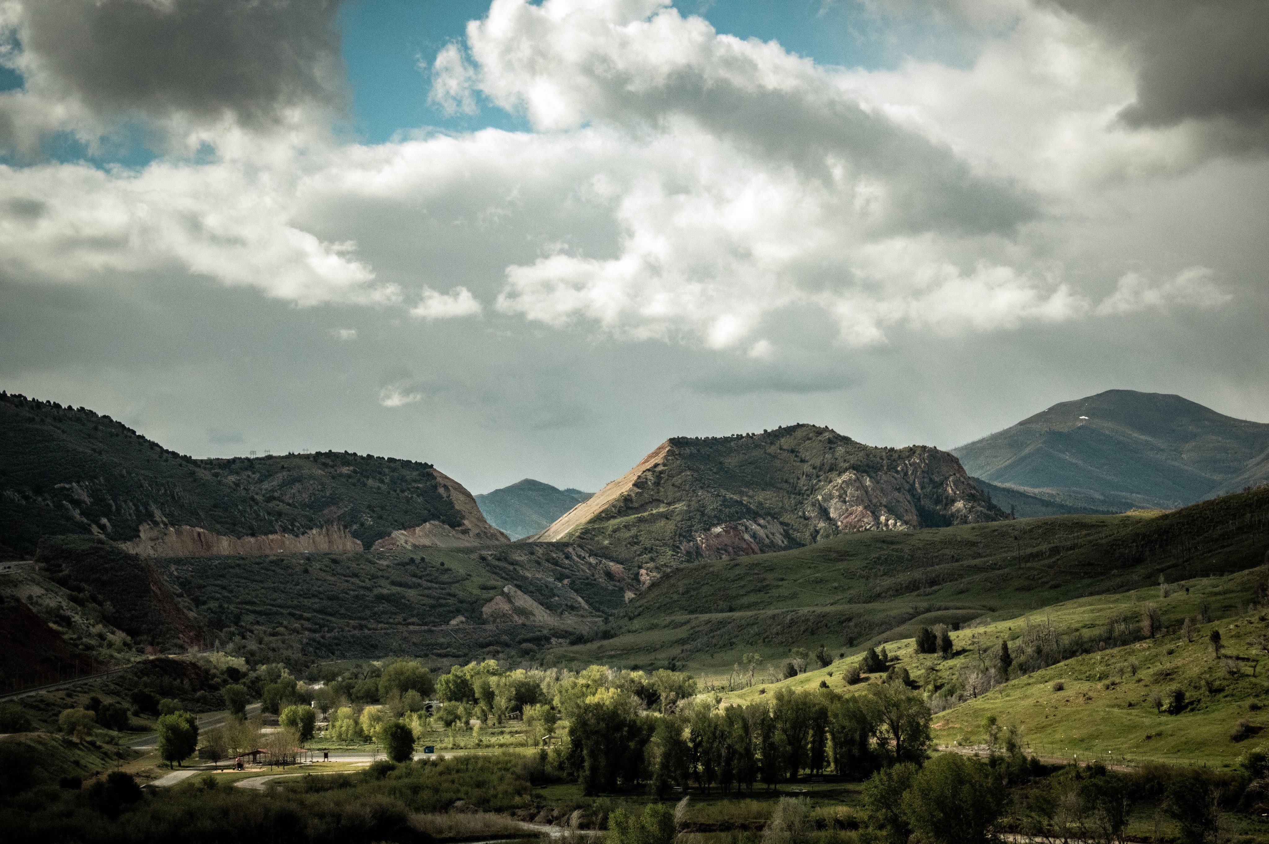 Small mountains covered in green vegetation.